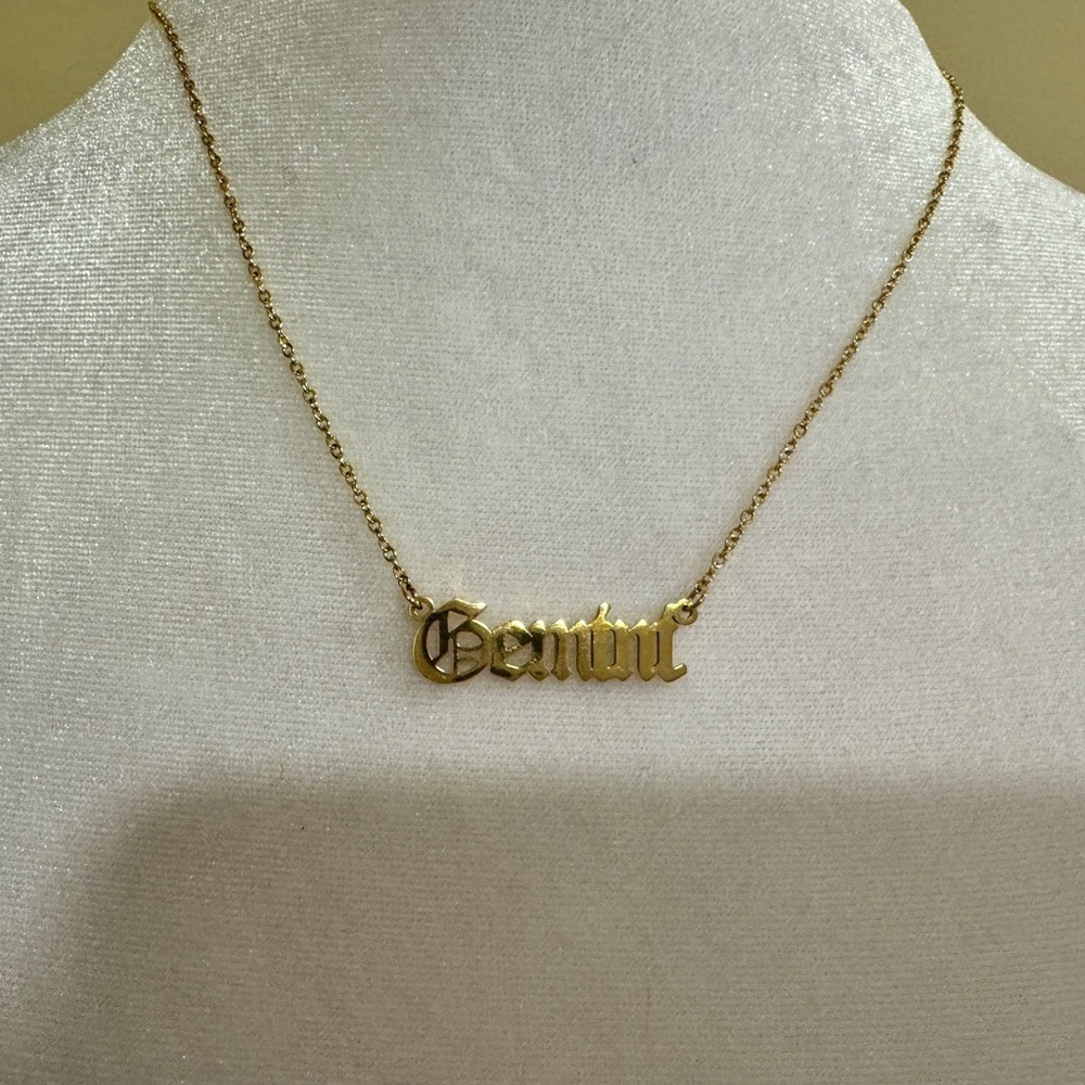 Gold toned old English Gemini necklace​​​​​​​​​